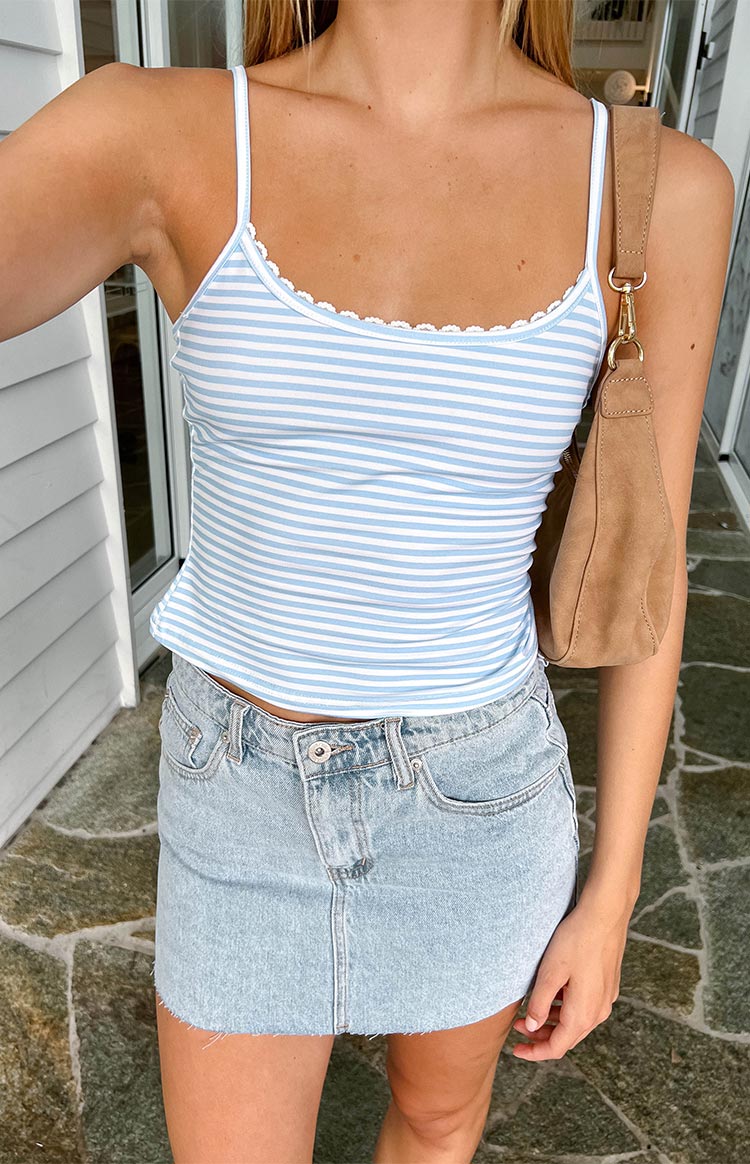 Close-up of the blue and white striped singlet with white scalloped lace trim along the neckline and thin spaghetti straps