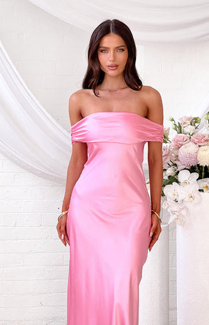 Pink satin off-shoulder maxi dress with a wide gathered neckline and elegant drape