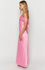 Side view of a pink satin off-shoulder maxi dress with ruched sleeves and a decorative tie on the arm