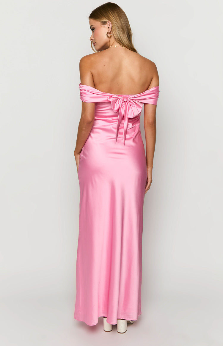 Rear view of a pink off-the-shoulder maxi dress with a large bow tie at the back and ruched sleeves