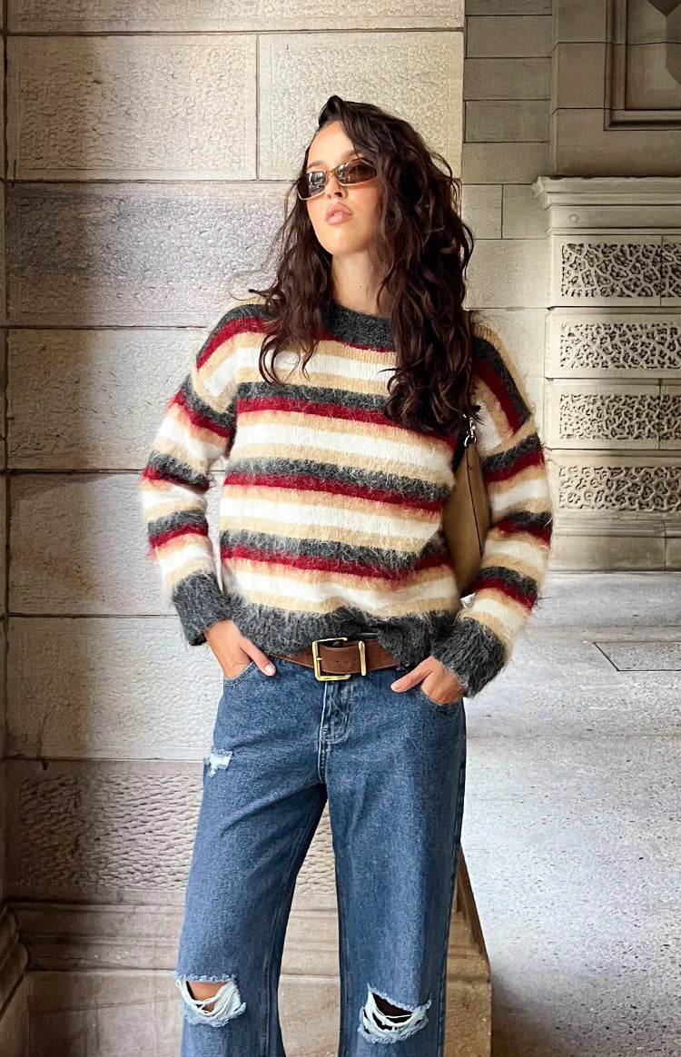 Fuzzy multi-stripe oversized sweater with white, beige, dark red, and grey stripes and a round neck