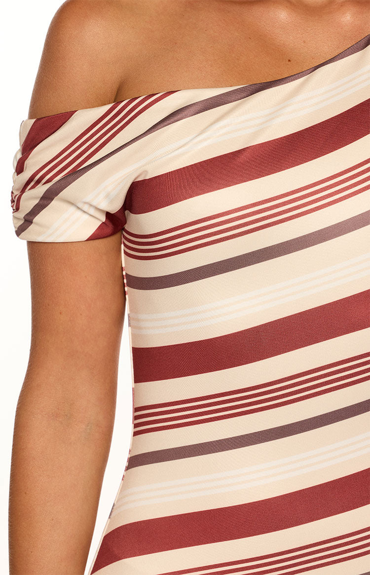 Close-up of the ruched off-shoulder sleeve and cream, red, and grey striped mini dress fabric