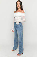 Mid wash denim straight leg jeans with scattered rhinestone embellishments
