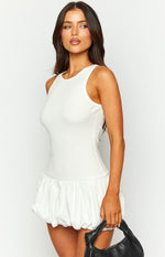 White ribbed knit sleeveless mini dress with a gathered bubble hem