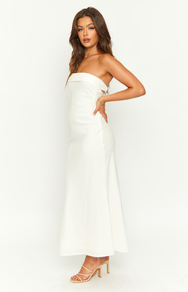 Side view of a cream strapless midi dress with a folded neckline and side waist cutouts