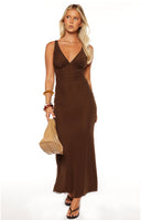 Model in the Sunflower Brown Mesh Maxi Dress a sheer strapless dress with a vibrant sunflower print perfect for a festival or vacation statement.