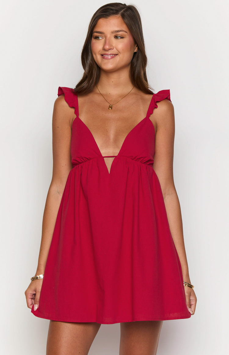 Deep V-neck red mini dress with a thin horizontal strap and ruffled shoulder straps
