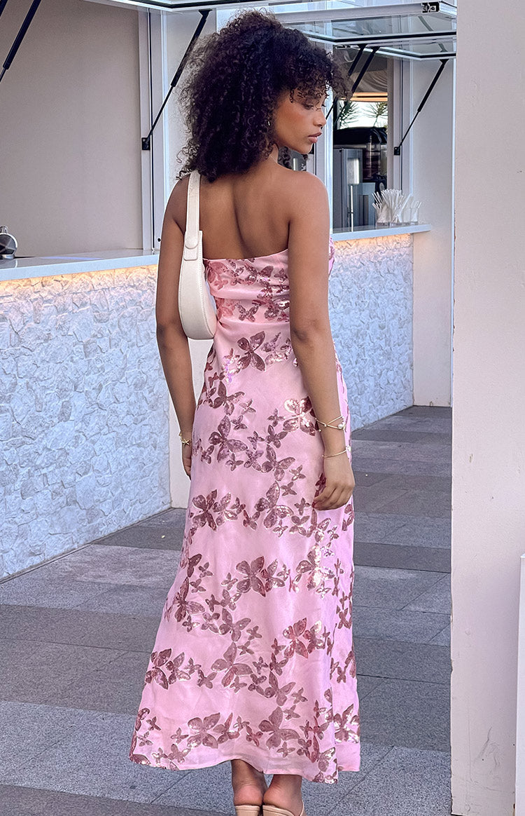 Pink strapless maxi dress with a fitted bodice and all-over butterfly sequin pattern to the hem