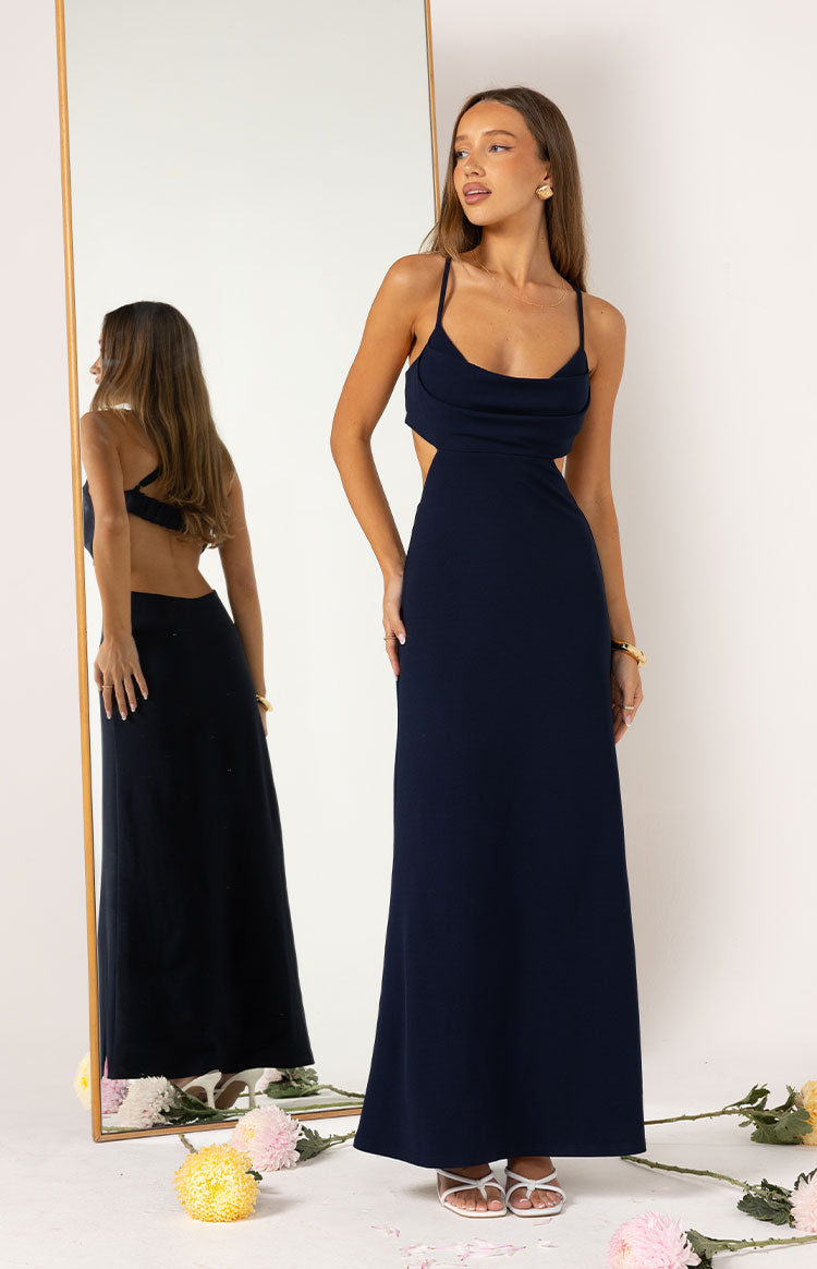 Navy crepe maxi dress with a cowl neck, side waist cutouts, and a low scoop back visible in the mirror