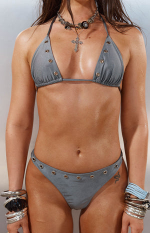 Front view of a grey sparkle triangle bikini top with silver eyelet details