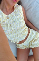 Beginning Boutique Tango Yellow Shorts yellow gingham high-waisted shorts with a ruffled hem and smocked waist