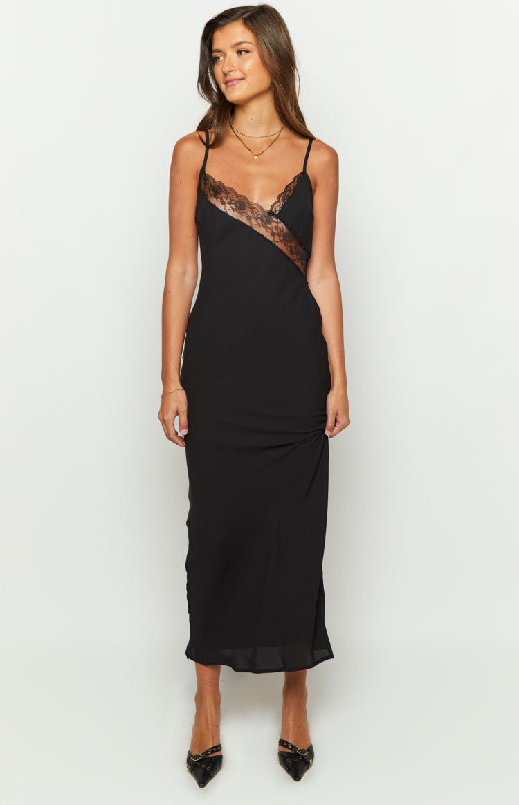 Front view of a black lace maxi dress with a ruched detail on the left side of the skirt