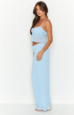 Side view of a light blue crinkled maxi skirt with a relaxed, flowy fit
