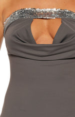 Close-up of the grey cowl neckline, cutout detail, and silver sequin trim of the mini dress
