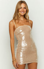Close-up of a gold sequin mini dress with a straight neckline and thin adjustable spaghetti straps