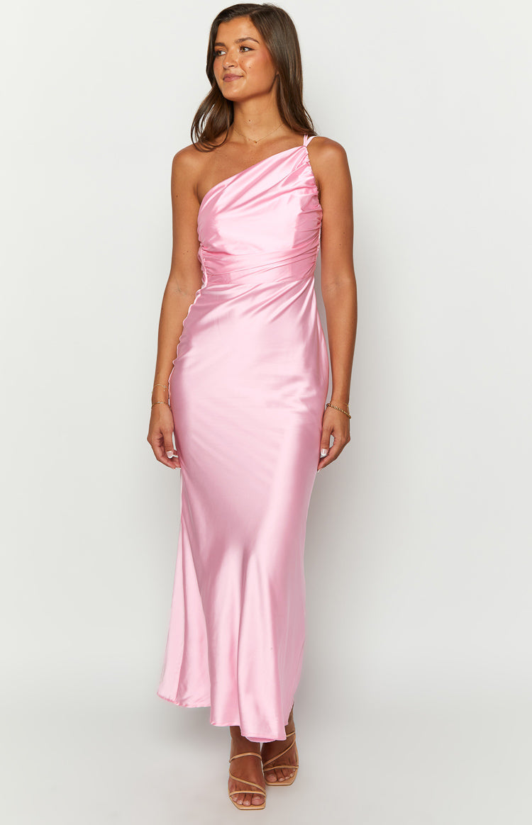 Front view of a pink satin one-shoulder maxi dress with a draped bodice and flowing skirt