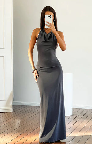 Fitted grey cowl neck maxi dress with silver stud detail on the halter strap