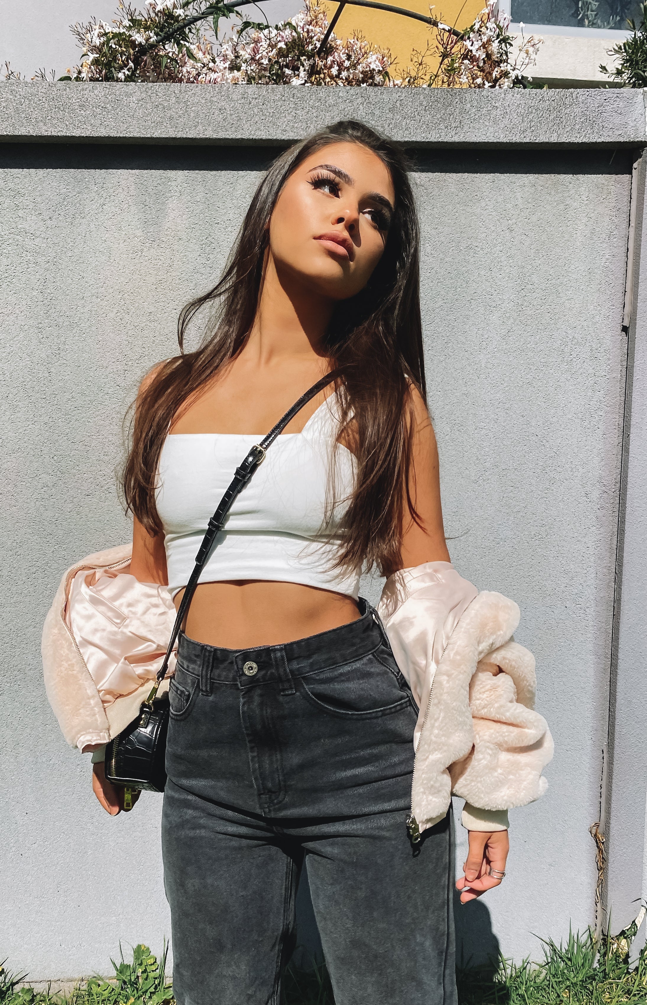 Faded black wash denim wide leg jeans with a high waist and front pockets