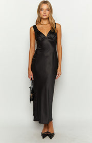 Front view of a black satin maxi dress with a deep V-neckline, gathered bust, and flowing silhouette