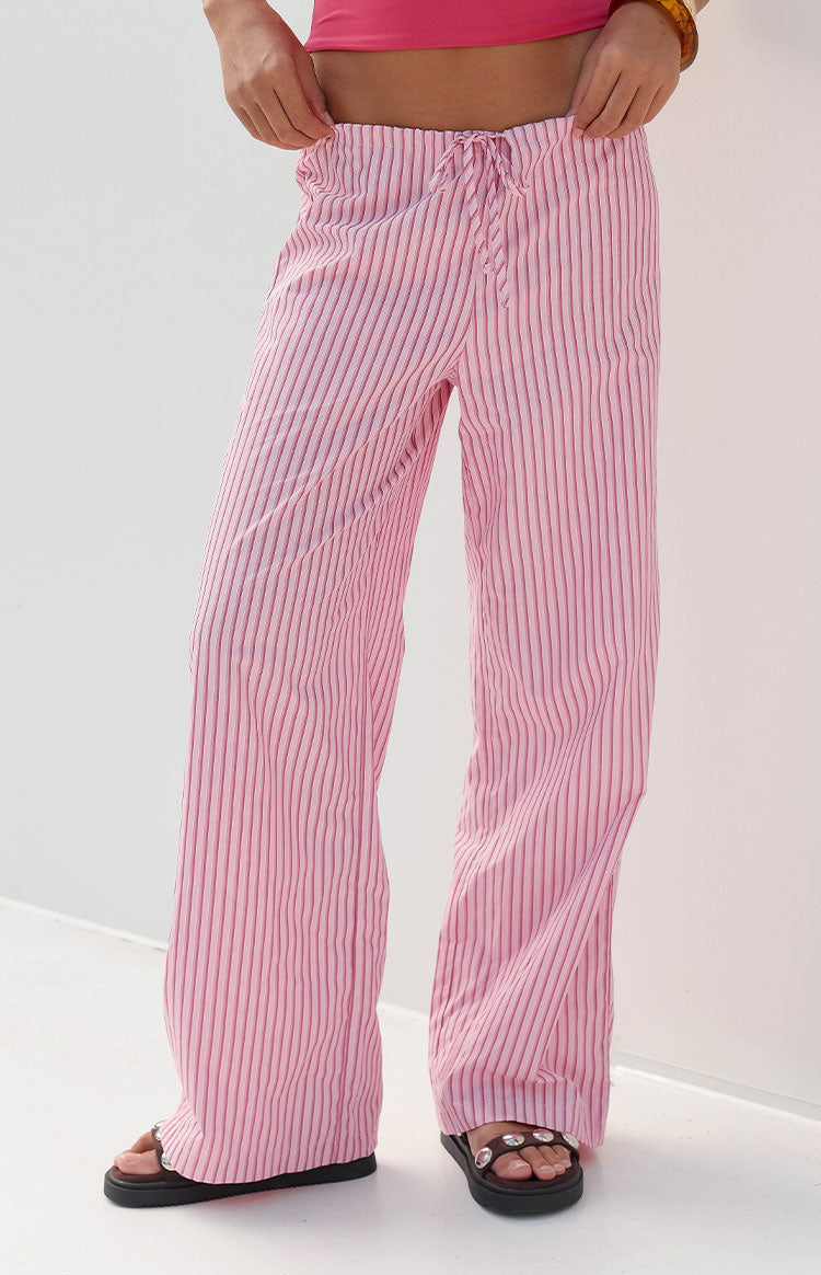 Pink and red striped wide-leg pants with a relaxed fit, drawstring waist, and crinkled texture