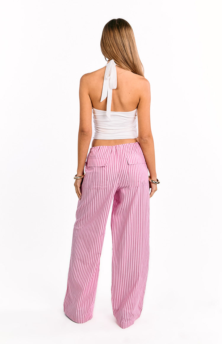Rear view of pink striped wide-leg pants with an elasticated waist and two flap pockets