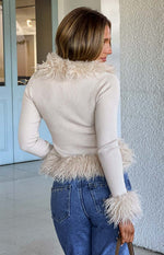 Beige ribbed knit cardigan with fluffy fur trim along the V-neckline and cuffs, cropped length