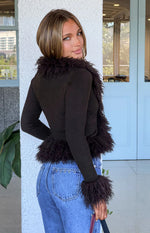 Chocolate ribbed knit cardigan with a deep V-neckline and fluffy fur trim along the front opening and cuffs