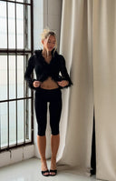 Beginning Boutique Violetta Black Fur Trim Knit Cardigan black ribbed knit cardigan with shaggy faux fur trim on neckline and