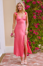 Pink satin V-neck maxi dress with ruffled shoulder straps and a high side slit with lace trim