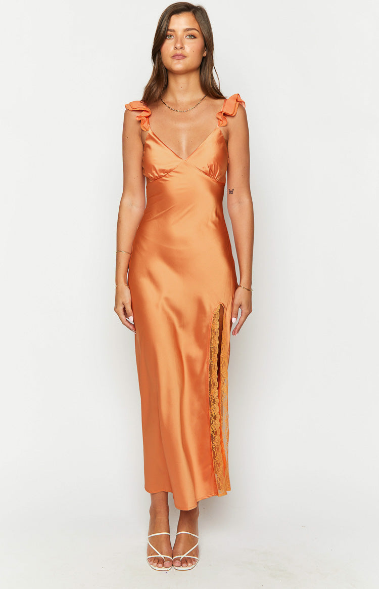 Orange satin V-neck maxi dress with ruffled shoulder straps and a high side slit revealing lace trim