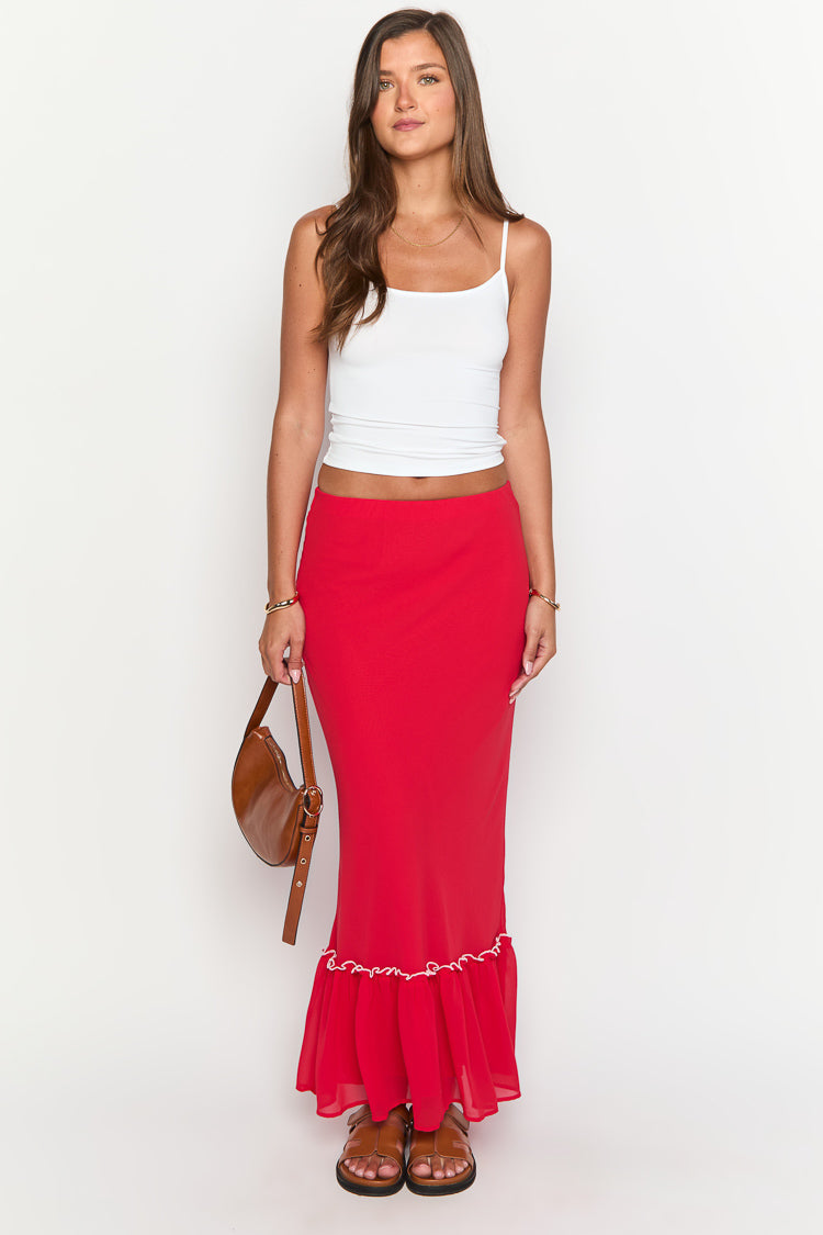 Red maxi skirt with a fitted silhouette and a ruffled hem featuring white trim