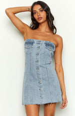 Front view of a light blue denim strapless mini dress with silver button-front and bust pockets