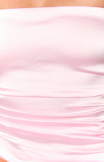 Close-up of the ruched detail on the pink satin strapless top showing its soft sheen and gathered texture
