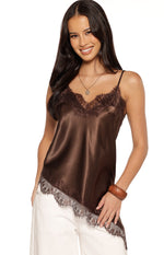 Front view of a brown satin top featuring a V-neckline with lace trim and an asymmetrical lace-trimmed hem