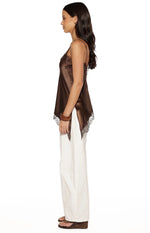 Side view of a brown satin top with thin spaghetti straps and an asymmetrical lace hemline