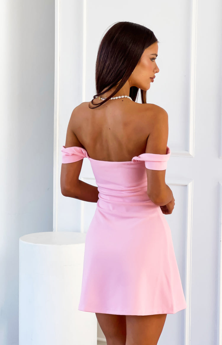 Rear view of a pink crepe off-shoulder mini dress with a fitted bodice and A-line skirt