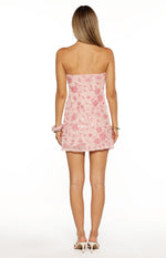 Rear view of a pink strapless mini dress with a straight back and all-over floral sequin and bead pattern