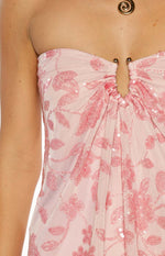 Close-up of the ruched bust detail with gold hardware and pink sequin floral pattern on a strapless mini dress