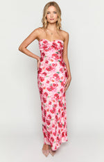 Front view of a pink floral maxi dress with a twisted bust detail and a fitted silhouette