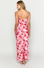Rear view of a pink floral strapless maxi dress with a fitted silhouette and straight hem