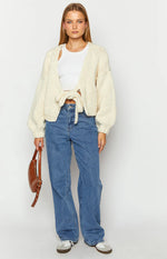 cream chunky knit sweater with voluminous balloon sleeves and a relaxed cropped fit