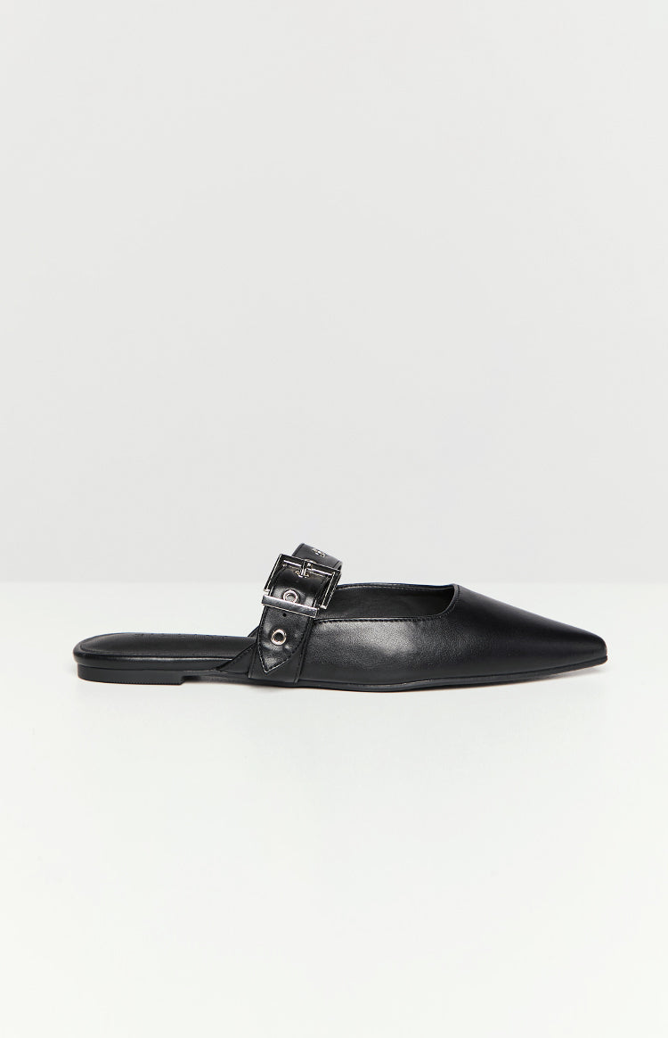 Side view of a black mule with a pointed toe and a buckled strap across the vamp