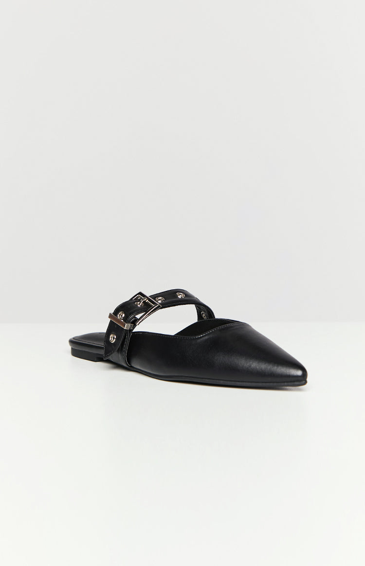 Side view of a black mule with a pointed toe and a silver buckle strap with eyelets