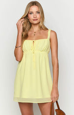 Yellow mini dress with a square neckline, wide straps, and a ruched bust featuring a central tie detail