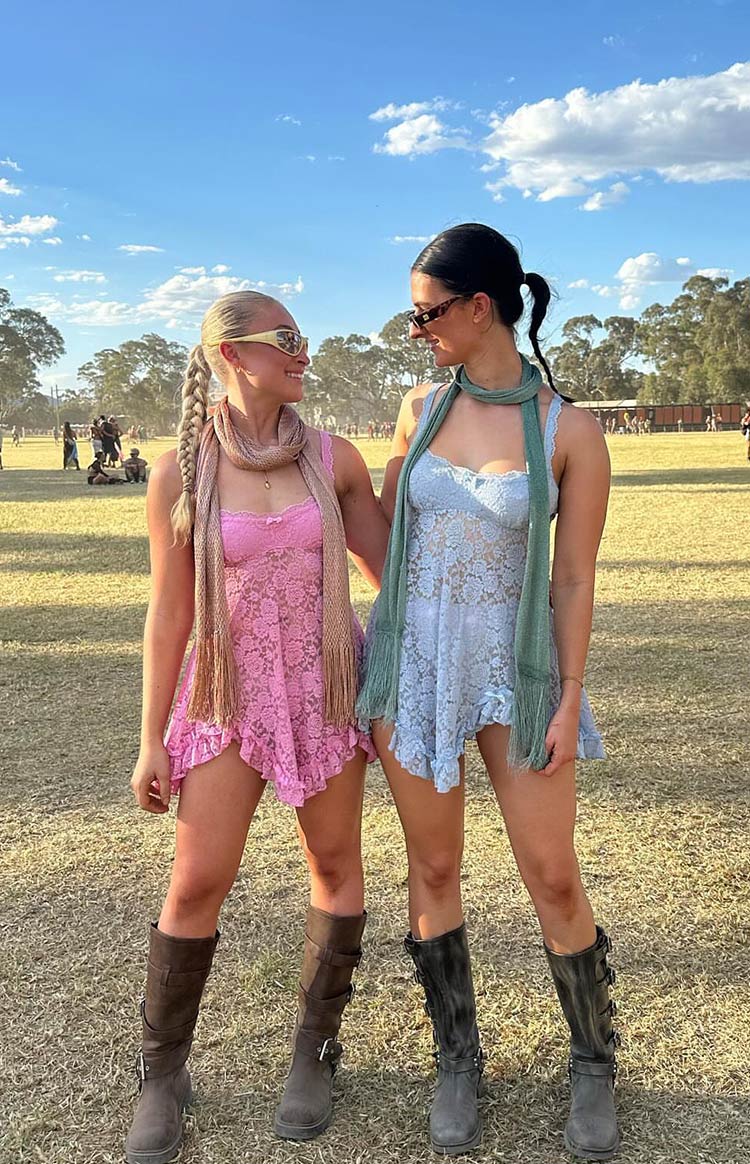 Light blue lace mini dress with a halter neckline, white lace trim, a small bow detail, and a ruffled hem