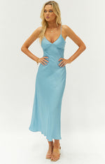Light blue satin maxi dress featuring a V-neck, thin straps, a fitted bodice with subtle gathering, and a flowing silhouette