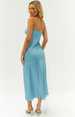 Side-back view of a blue satin maxi dress with thin adjustable straps and a flowing, bias-cut skirt