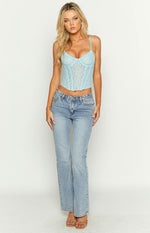 Light blue lace corset top with sweetheart neckline, thin spaghetti straps, and visible boning detail