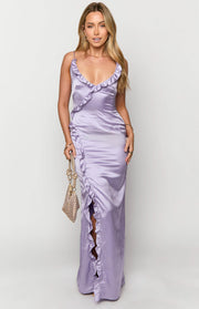 Lilac satin maxi dress with a ruffled V-neckline, spaghetti straps, and a ruffled side slit