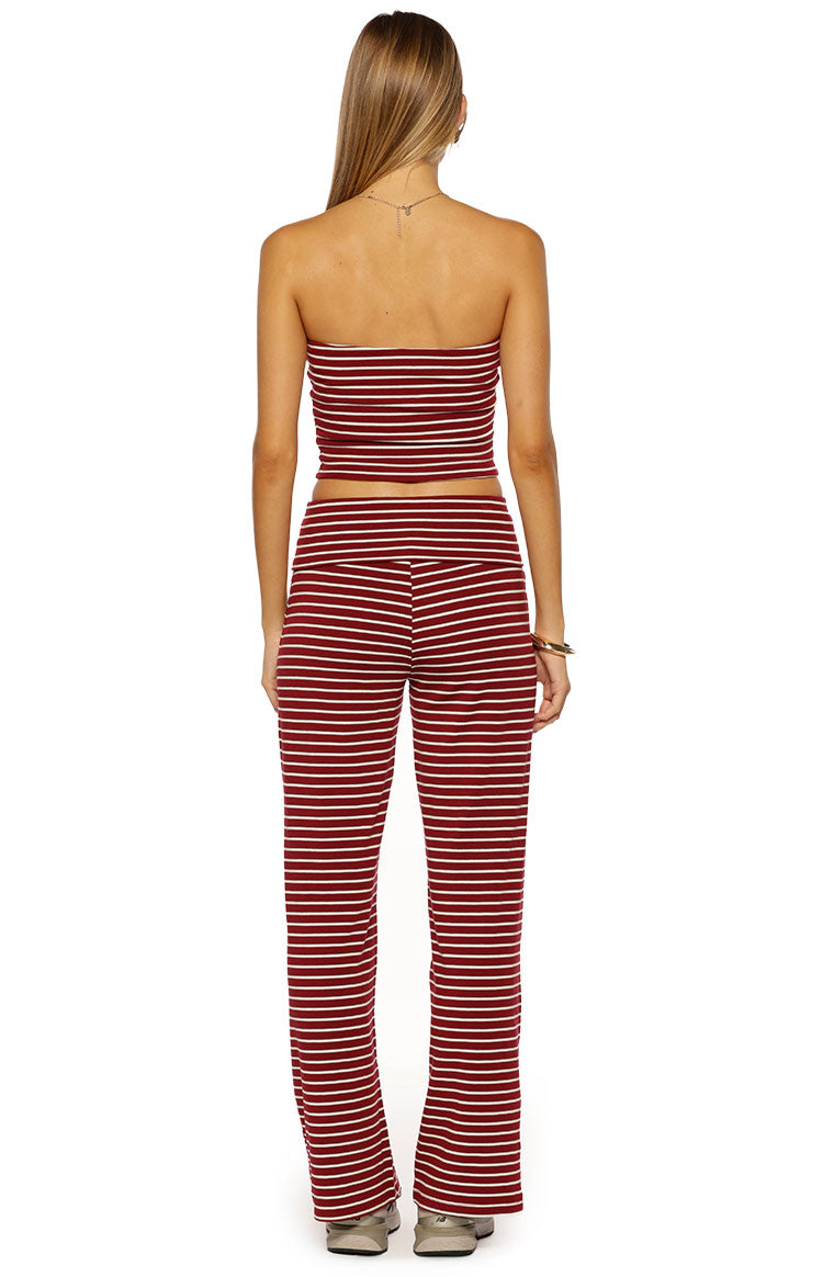 Rear view of burgundy and white striped wide-leg pants, showing the wide foldover waistband